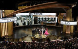 The cast and crew of 'Everything Everywhere All at Once' accepts the award for best picture at the Oscars at the Dolby Theatre in Los Angeles, on March 12, 2023. (Chris Pizzello/AP)