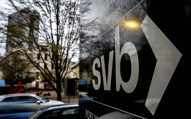 A sign of a branch of the Silicon Valley Bank is pictured at an office building where the bank is located in Frankfurt, Germany, March 13, 2023. (AP Photo/Michael Probst)