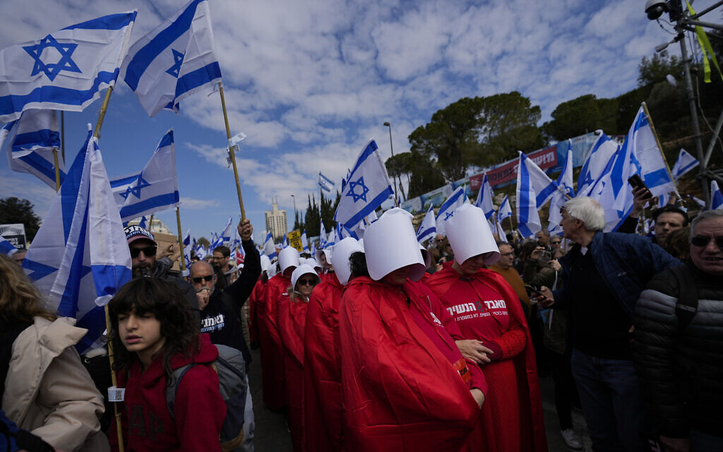 File: Protesters supporting women's rights dressed as characters from "The Handmaid's Tale" TV series attend a protest against the government's plans to overhaul the judicial system, outside the Knesset in Jerusalem, February 13, 2023. (AP/Ohad Zwigenberg)