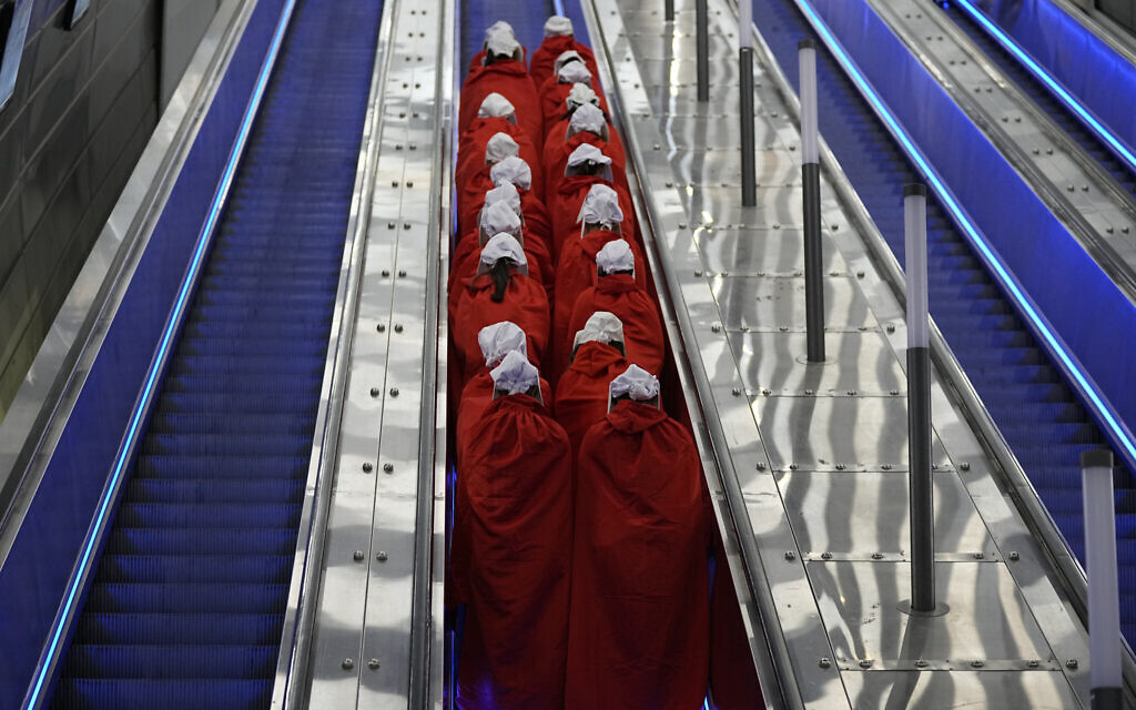 File: Protesters supporting women's rights dressed as characters from 'The Handmaid's Tale' TV series attend a protest against the government's plans to overhaul the judicial system, at a railway station in Jerusalem, March 1, 2023. (AP/Ohad Zwigenberg)