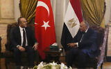 Egyptian Foreign Minister Sameh Shoukry, right, meets with his Turkish counterpart Mevlut Cavusoglu at Tahrir Palace in Cairo, Egypt, March 18, 2023 (AP Photo/Amr Nabil)