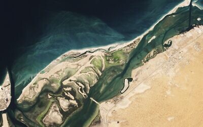 This satellite image from Planet Labs PBC shows Siniyah Island in Umm al-Quwain, United Arab Emirates, March 16, 2023. (Planet Labs PBC via AP)