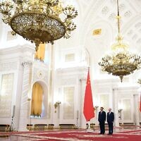 Russian President Vladimir Putin, right, and Chinese President Xi Jinping attend an official welcome ceremony at The Grand Kremlin Palace, in Moscow, Russia, March 21, 2023. (Alexey Maishev, Sputnik, Kremlin Pool Photo via AP)