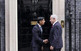 Britain's Prime Minister Rishi Sunak, left, welcomes Prime Minister Benjamin Netanyahu at 10 Downing Street in London, March 24, 2023. (AP Photo/Alberto Pezzali)