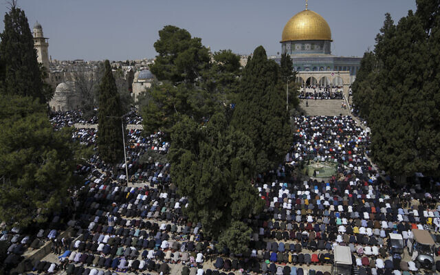 Muslims offer prayer on the first Friday of Ramadan outside the Dome of Rock at the Al-Aqsa Mosque on the Temple Mount in Jerusalem's Old City, Friday, March 24, 2023. (AP Photo/Mahmoud Illean)