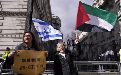 Protestors demonstrate during the visit of Israeli Prime Minister Benjamin Netanyahu to 10 Downing Street in London, Friday, March 24, 2023.(AP Photo/Alberto Pezzali)