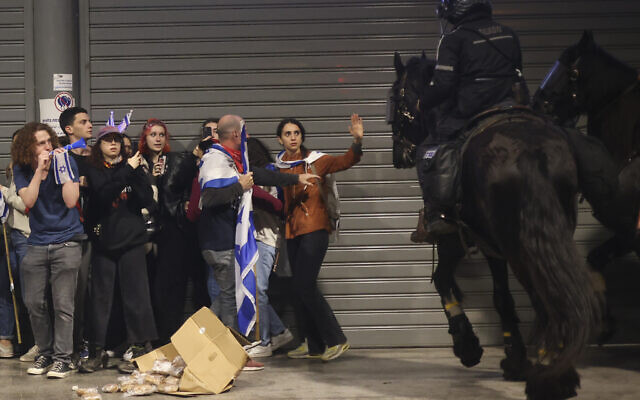 Mounted police disperse and anti government protesters in Tel Aviv on Monday, March 27, 2023. (AP Photo/Oren Ziv)