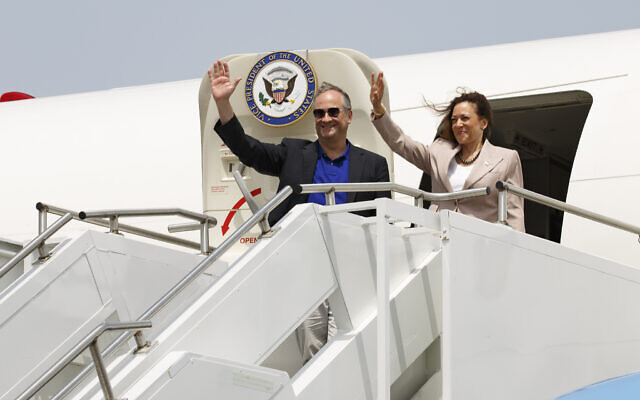 US Vice President Kamala Harris and second gentleman Douglas Emhoff wave as they depart Accra, Ghana, for Dar Es Salaam, Tanzania, Wednesday March 29, 2023. (AP Photo/Misper Apawu)