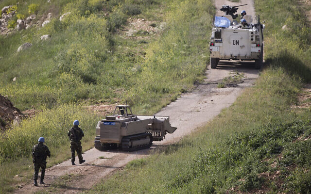 File: UN peacekeepers from Ireland patrol Israel's border with Syria, April 27, 2015. (AP Photo/Ariel Schalit)
