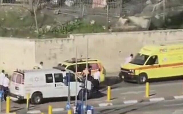Screen capture from video of Red Crescent ambulances transferring three children who were critically injured in a traffic accident in East Jerusalem to Magen David Adom ambulances at a checkpoint, March 2, 2023. (Twitter. Used in accordance with Clause 27a of the Copyright Law)