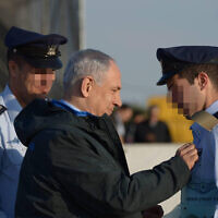 FILE: Prime Minister Benjamin Netanyahu attends the graduation ceremony of new Israeli Air Force pilots at the Hatzerim Air Force base, December 31, 2015 (Photo by Amos Ben Gershom/GPO)
