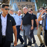 File: Prime Minister Benjamin Netanyahu walks with Amir Eshel, the Commander in Chief of the Israel Air Force, at Tel Nof Airofrce base, on August 17, 2016. (Flash90)
