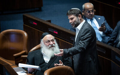 Religious Zionism head Bezalel Smotrich (standing) with United Torah Judaism leader Yitzchak Goldknopf at the Knesset on November 21, 2022. (Yonatan Sindel/Flash90)