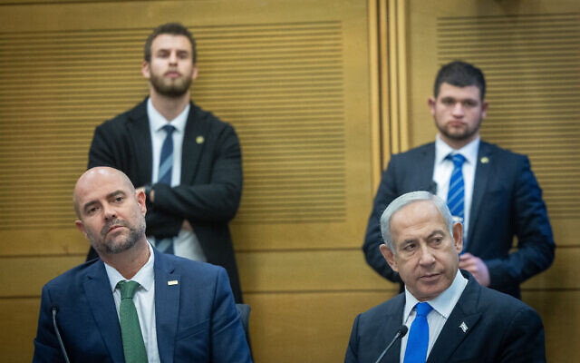 Prime Minister Benjamin Netanyahu (R) with Knesset Speaker Amir Ohana during a Likud party meeting at the Knesset on February 6, 2023. (Yonatan Sindel/Flash90)