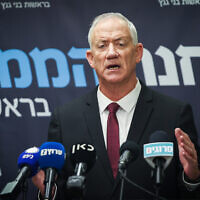 Leader of the National Unity Party MK Benny Gantz speaks to the media at the Knesset, in Jerusalem, on March 1, 2023. (Yonatan Sindel/Flash90)