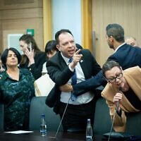Yisrael Beytenu MK Yulia Malinovsky (right) and Yesh Atid MK Vladimir Beliak (left) remonstrate with Knesset Constitution, Law, and Justice Committee Chair MK Simcha Rothman, March 1, 2023. (Yonatan Sindel/Flash90)