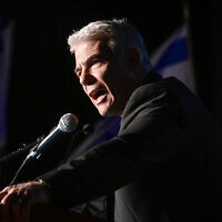 Opposition leader Yair Lapid speaks at a rally against the government's planned judicial overhaul, in the central city of Herzliya, March 4, 2023. (Avshalom Sassoni/Flash90)
