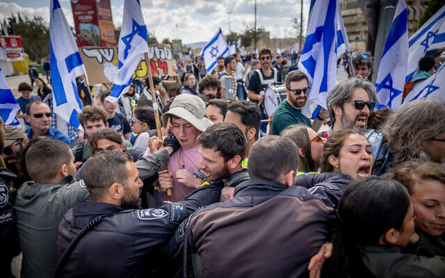 Students clash with police during a protest against the Israeli government's planned judicial overhaul, near the Supreme Court in Jerusalem, March 9, 2023. (Yonatan Sindel/Flash90)