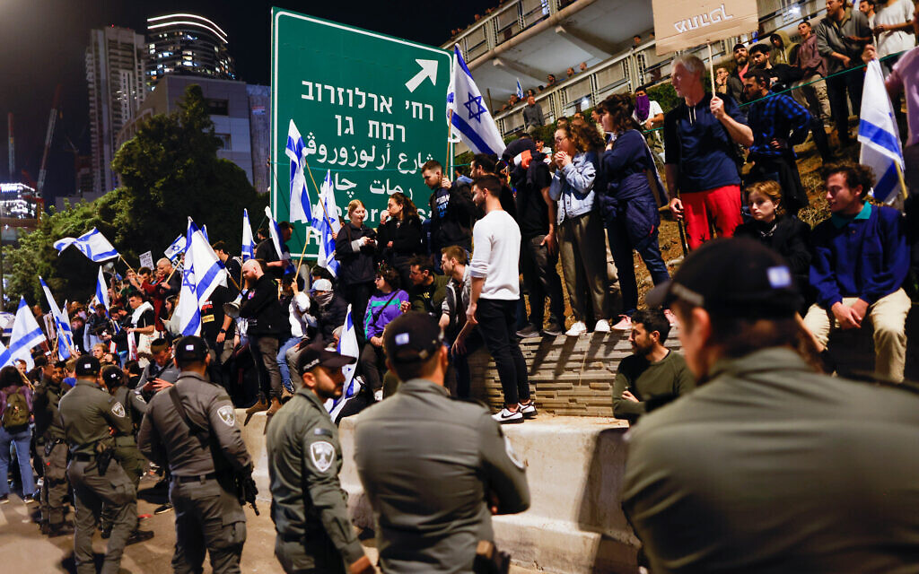 Protesters block the Ayalon Highway during a demonstration against the government's planned judicial overhaul, in Tel Aviv, on March 11, 2023. (Erik Marmor/Flash90)