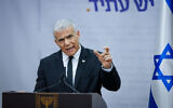 Head of the Yesh Atid party MK Yair Lapid speaks during a faction meeting at the Knesset in Jerusalem, on March 13, 2023. (Erik Marmor/Flash90)
