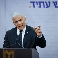Head of the Yesh Atid party MK Yair Lapid speaks during a faction meeting at the Knesset in Jerusalem, on March 13, 2023. (Erik Marmor/Flash90)