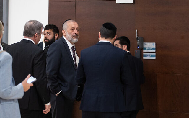 Shas party chair Aryeh Deri arrives for a meeting with Prime Minister Benjamin Netanyahu at his office at the Knesset, in Jerusalem, on March 15, 2023. (Oren Ben Hakoon/Flash90)