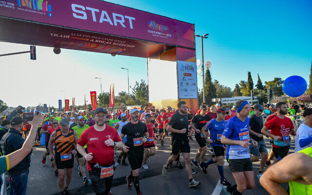 Tens of thousands of runners take part in the 12th annual Jerusalem marathon, March 17, 2023. (Arie Leib Abrams/Flash90)