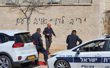 Graffiti denouncing Justice Minister Yariv Levin as 'the enemy of the people' is seen spray-painted on a wall at his home in the central city of Modiin, on March 17, 2023. (Jonathan Shaul/Flash90)