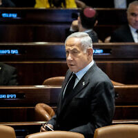 Prime Minister Benjamin Netanyahu seen during a discussion and a vote in the Knesset, Jerusalem, on March 22, 2023. (Yonatan Sindel/Flash90)