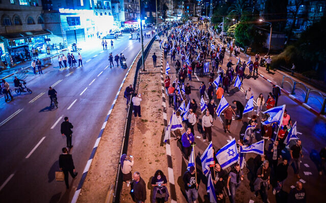 Protesters march as they protest against the government's judicial overhaul plans, in Bnei Brak, on March 23, 2023. (Avshalom Sassoni/Flash90)
