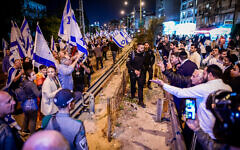 Protesters march against the government's judicial overhaul plans, in Bnei Brak, on March 23, 2023. (Avshalom Sassoni/Flash90)