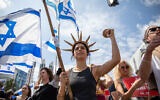 Israelis protest against the government's planned judicial overhaul in Haifa, March 27, 2023. (Shir Torem/Flash90)