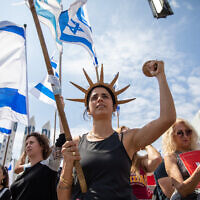 Israelis protest against the government's planned judicial overhaul in Haifa, March 27, 2023. (Shir Torem/Flash90)