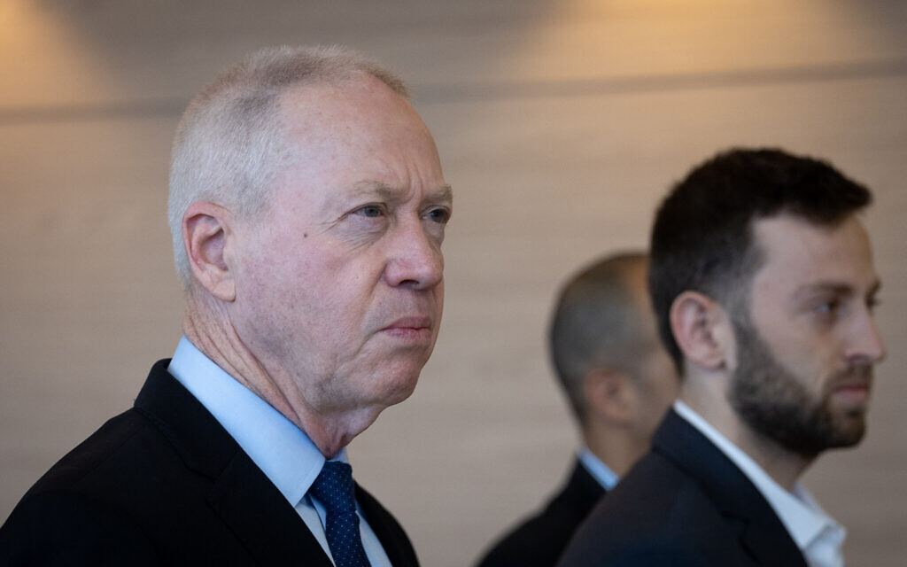 Minister of Defense Yoav Galant arrives for a meeting of the Defense and Foreign Affairs Committee at the Knesset, on March 27, 2023. (Yonatan Sindel/Flash90)