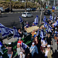 Israelis protest against the government's planned judicial overhaul, in Tel Aviv on March 28, 2023. (Tomer Neuberg/ Flash90)