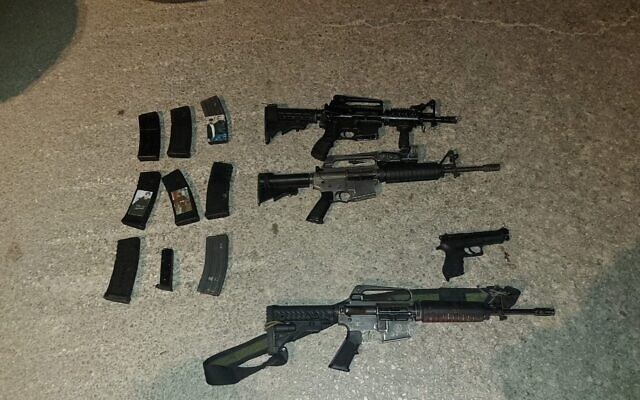 Firearms and magazines seized from Palestinian assailants who opened fire at Israeli troops on March 12, 2023. (Israel Defense Forces)