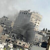 Smoke rises from a building during an IDF raid on Jenin on March 7, 2023 (Twitter/Used in accordance with Clause 27a of the Copyright Law)