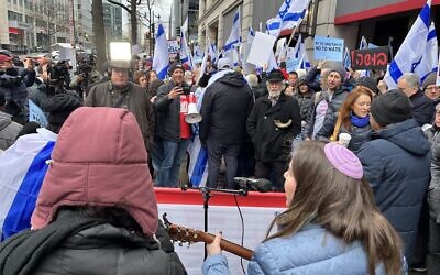 Jewish Americans and Israeli ex-pats protest against Finance Minister Bezalel Smotrich outside the Grand Hyatt hotel in Washington on March 12, 2023. (Jacob Magid/Times of Israel)