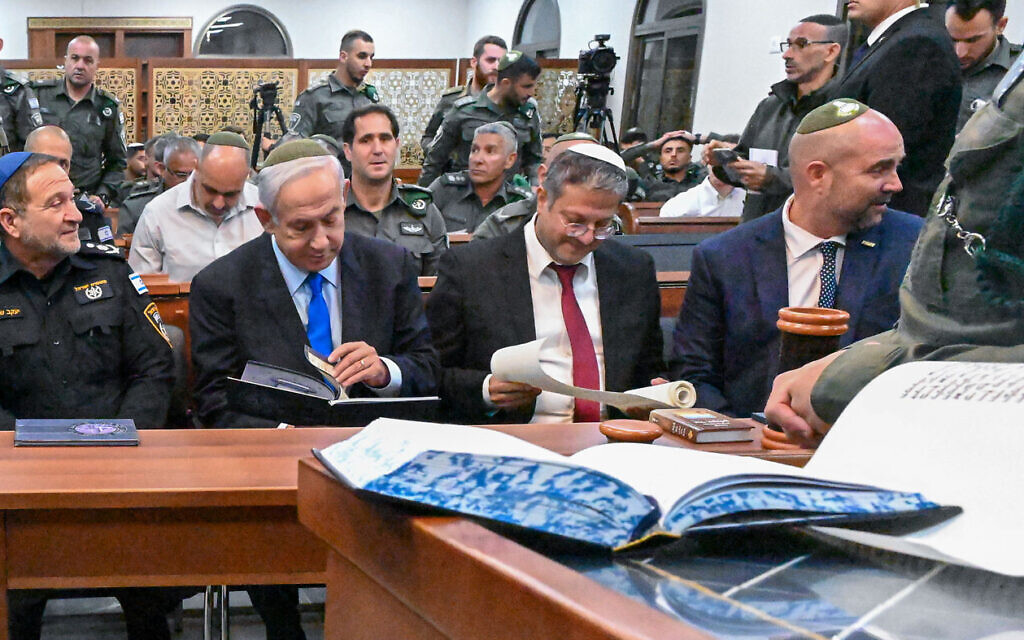 From left, police chief Kobi Shabtai, Prime Minister Benjamin Netanyahu, National Security Minister Itamar Ben Gvir and Knesset Speaker Amir Ohana at a Purim megillah reading on a Border Police base in the West Bank on March 6, 2023. (Kobi Gideon / GPO)