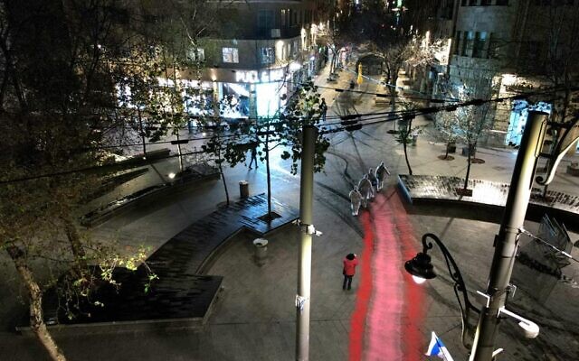 During Wednesday night, March 15, dozens of protesters painted the road leading from Jerusalem's Russian Compound to the Supreme Court, in a move meant to represent the inseparable connection between an independent judicial system and freedom of expression (Courtesy Amir Goldstein)