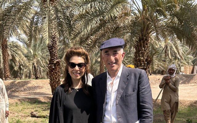 Rick Sopher and his wife Carol planting a date palm in Medina (Courtesy of the Sophers and the Jewish Chronicle)