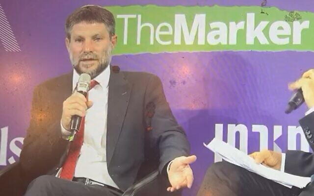 Finance Minister and Minister in the Defense Ministry Bezalel Smotrich speaks at a conference hosted by The Marker on March 1, 2023. (Screenshot: Twitter; Used in accordance with Clause 27a of the Copyright Law)