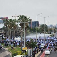 Police use a water cannon against anti-overhaul protests in Haifa, March 23, 2023 (Israel Police)