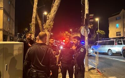 Police seen at the scene of a murder in Kiryat Ata on March 24, 2023. (Israel Police)