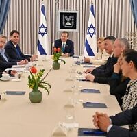 President Isaac Herzog hosts delegations from Likud, Yesh Atid and National Unity for judicial overhaul negotiations at his residence in Jerusalem, March 28, 2023. (Kobi Gideon/GPO)