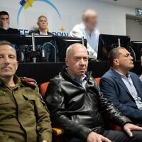 Defense Minister Yoav Gallant (center), Defense Ministry Director General Eyal Zamir (right) and deputy IDF chief of staff Amir Baram (left) are seen during the launch of the Ofek-13 reconnaissance satellite, March 29, 2023. (Defense Ministry)