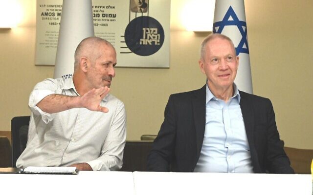 Defense Minister Yoav and Shin Bet chief Ronen Bar are seen at the Shin Bet headquarters in Tel Aviv, March 30, 2023. (Ariel Hermoni/Defense Ministry)