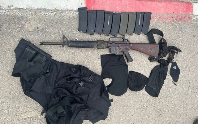 An assault rifle and other military gear seized by Israeli forces from a wanted Palestinian gunman who was killed, March 23, 2023. (Israel Defense Forces)