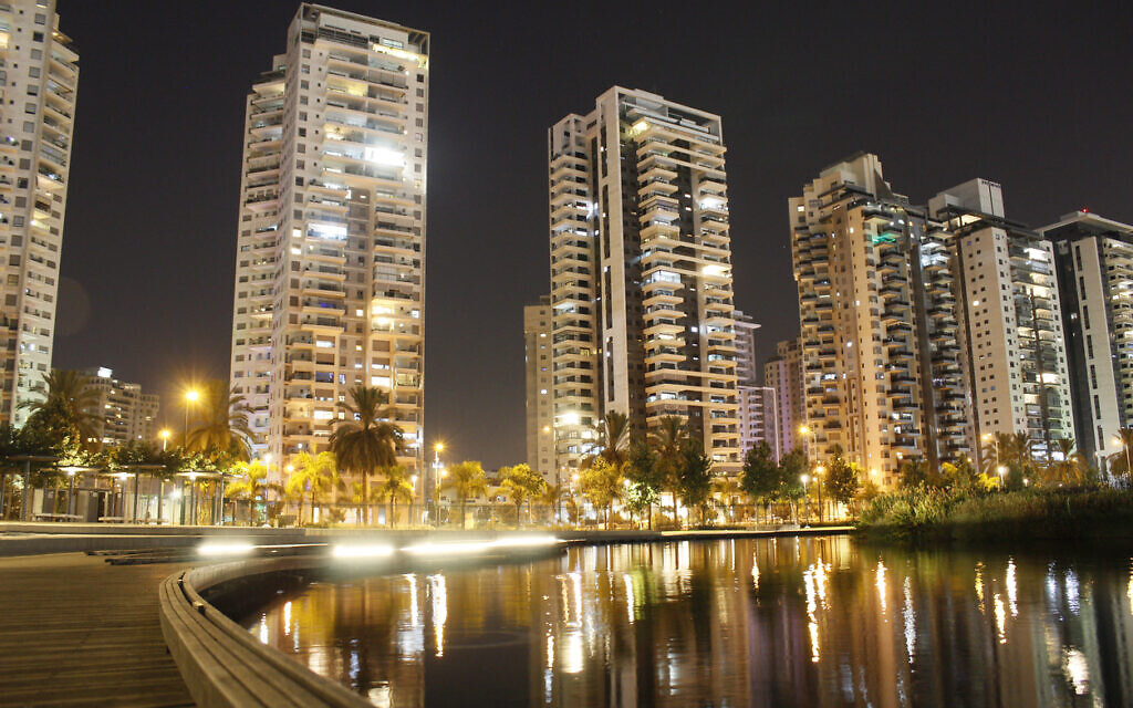 Lit-up apartment building in Petah Tikva, August 2021. (Itay Tamir via iStock by Getty Images)