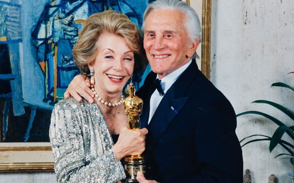 Kirk Douglas and his wife Anne Douglas hold his honorary Oscar in 1996. (Courtesy of The Douglas Archive)